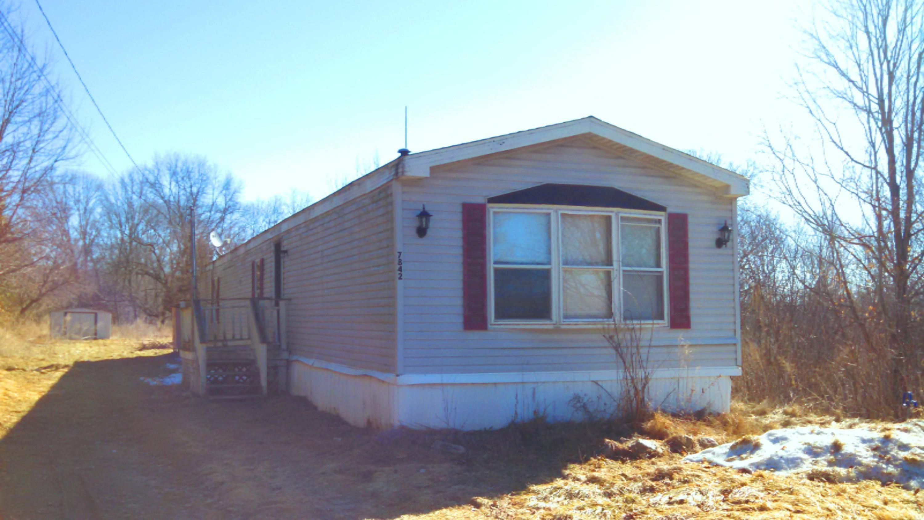 7842 Cowman Road Hubbardston, MI 48845 - Photo 1 of 25 Cowman ext front.jpg