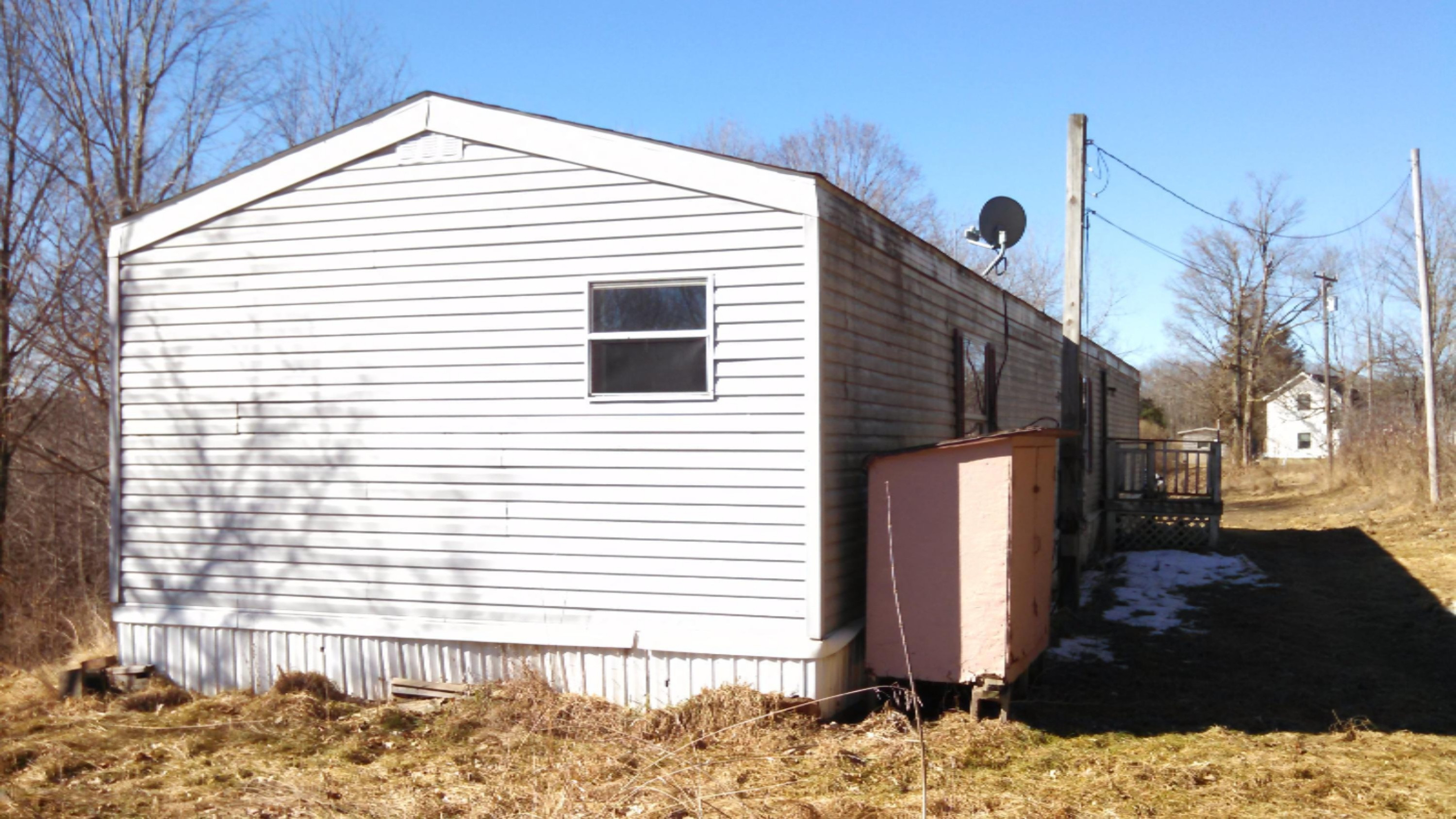 7842 Cowman Road Hubbardston, MI 48845 - Photo 2 of 25 Cowman ext back.jpg