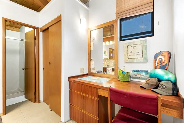 a dining room filled with furniture and mirror