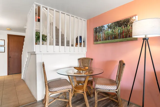 a dining room with furniture and wooden floor