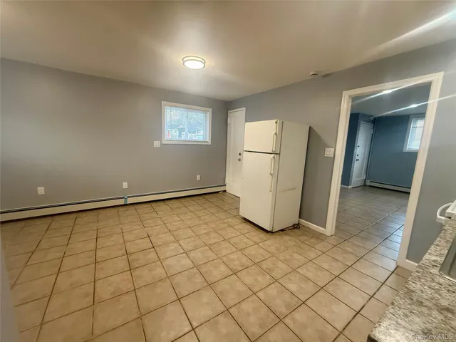 a view of a room with a refrigerator