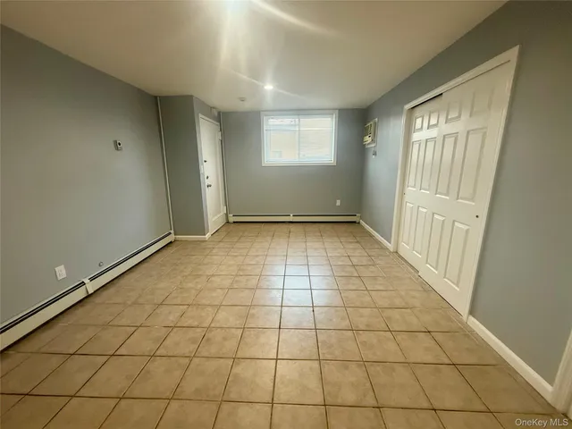 a view of an empty room and window