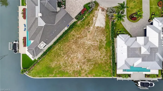 an aerial view of a house with a swimming pool