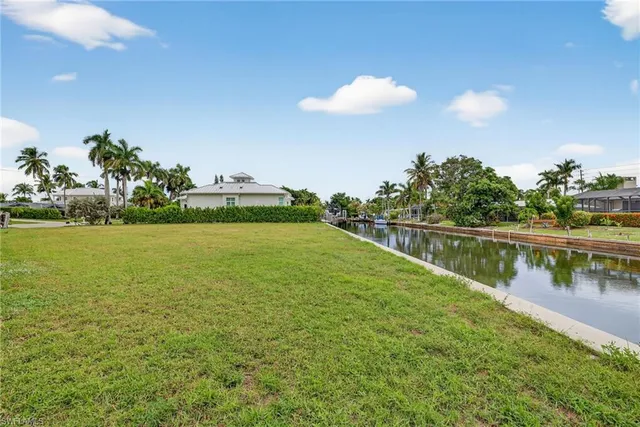 a view of a lake with a house in the background