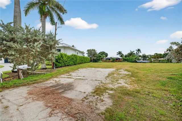 a view of a lake with a house in background