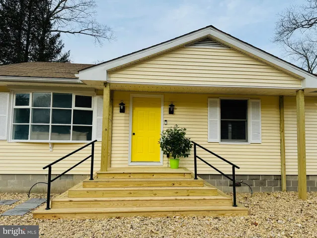 a view of a house with a window and stairs