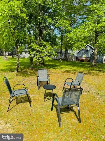 a view of a swimming pool with lounge chairs