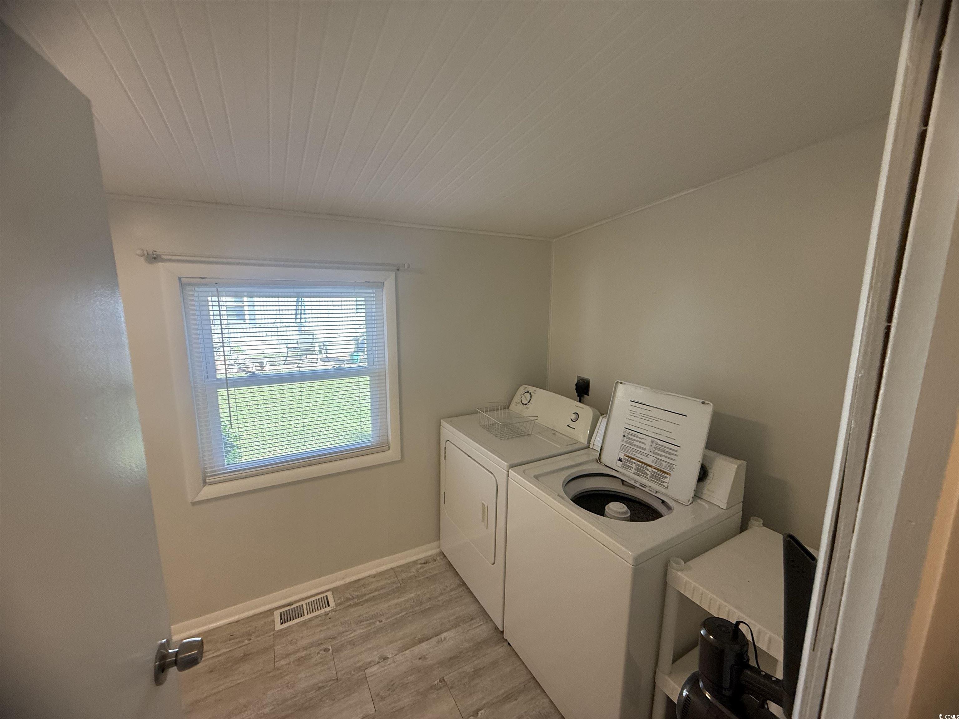 826 Jensen Drive North Murrells Inlet, SC 29576 - Photo 13 of 38 Laundry room with light wood finished floors and washer and dryer