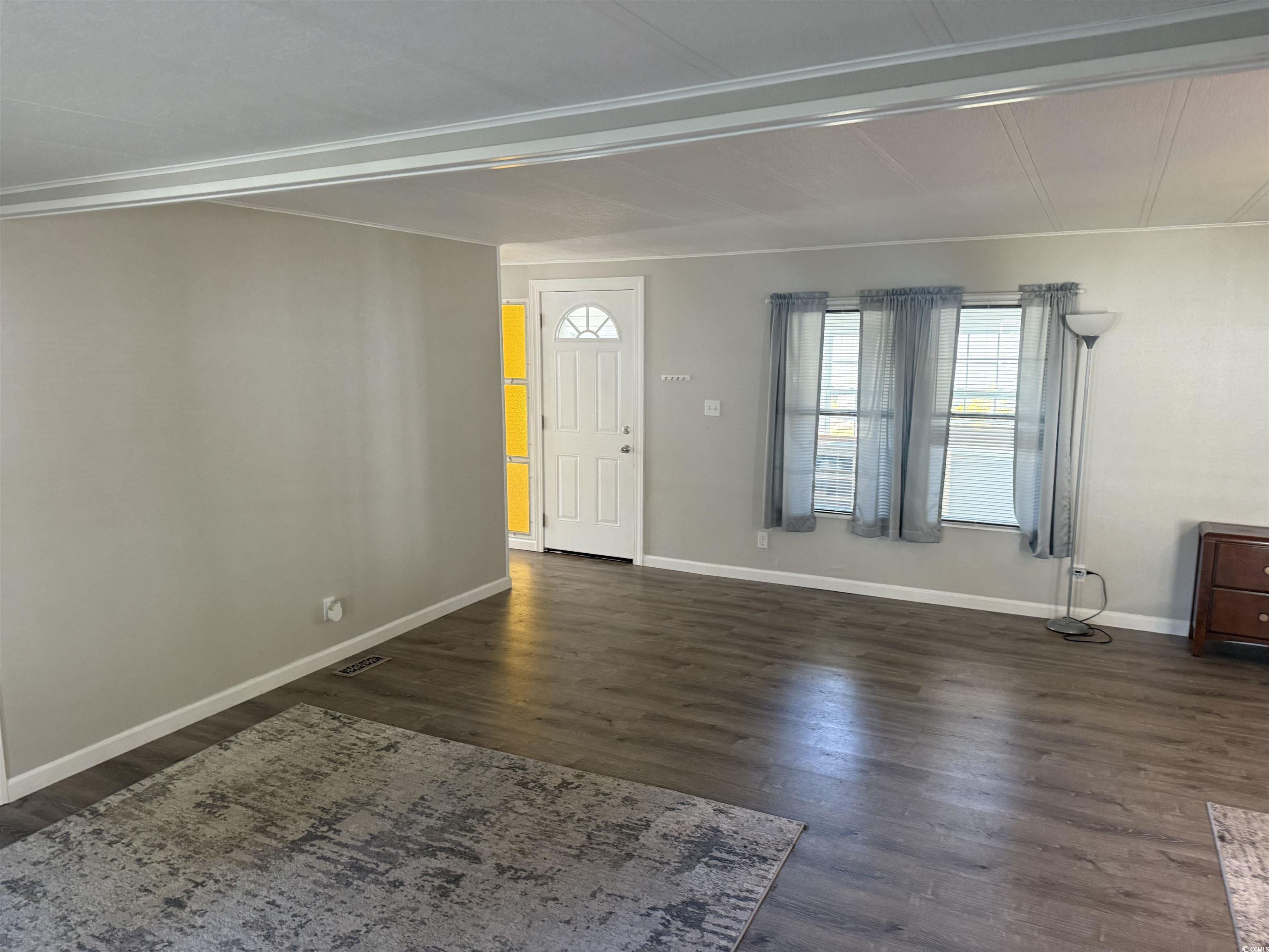 826 Jensen Drive North Murrells Inlet, SC 29576 - Photo 14 of 38 Entrance foyer with dark wood-style floors and baseboards