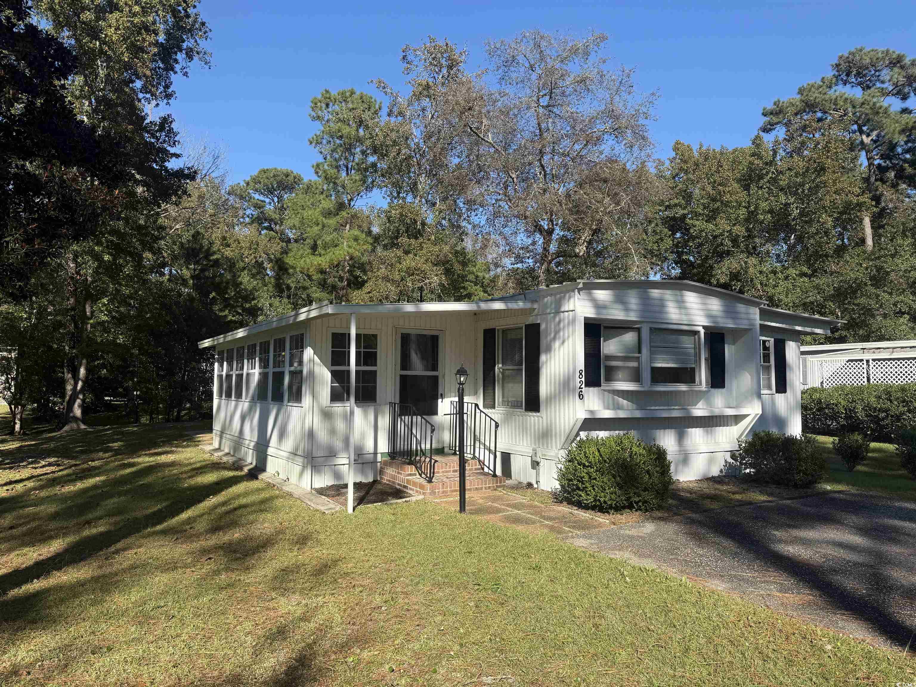 826 Jensen Drive North Murrells Inlet, SC 29576 - Photo 2 of 38 Manufactured / mobile home featuring a front yard