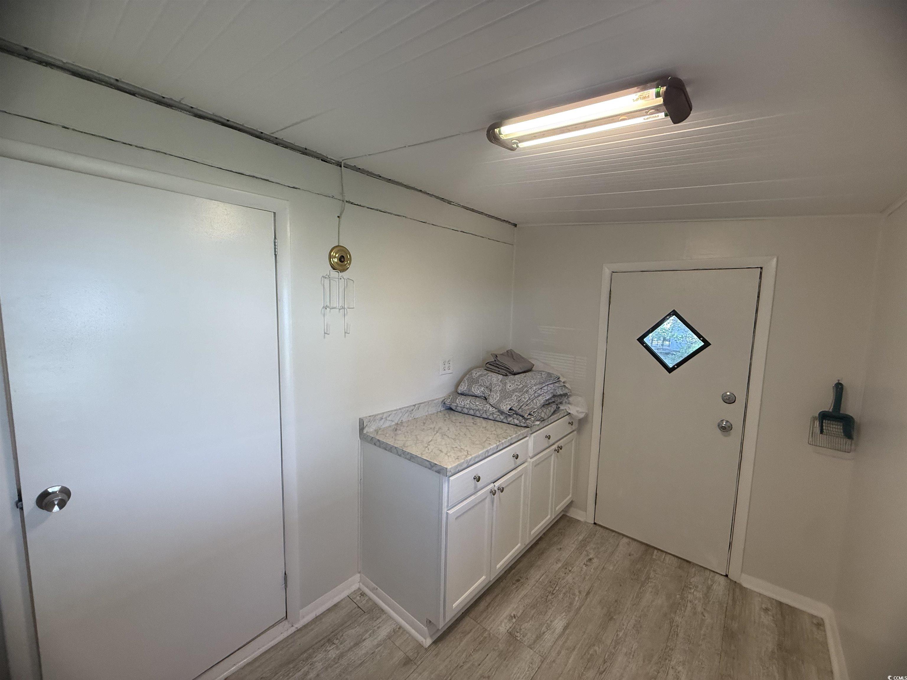826 Jensen Drive North Murrells Inlet, SC 29576 - Photo 25 of 38 Doorway with wood finished floors and baseboards