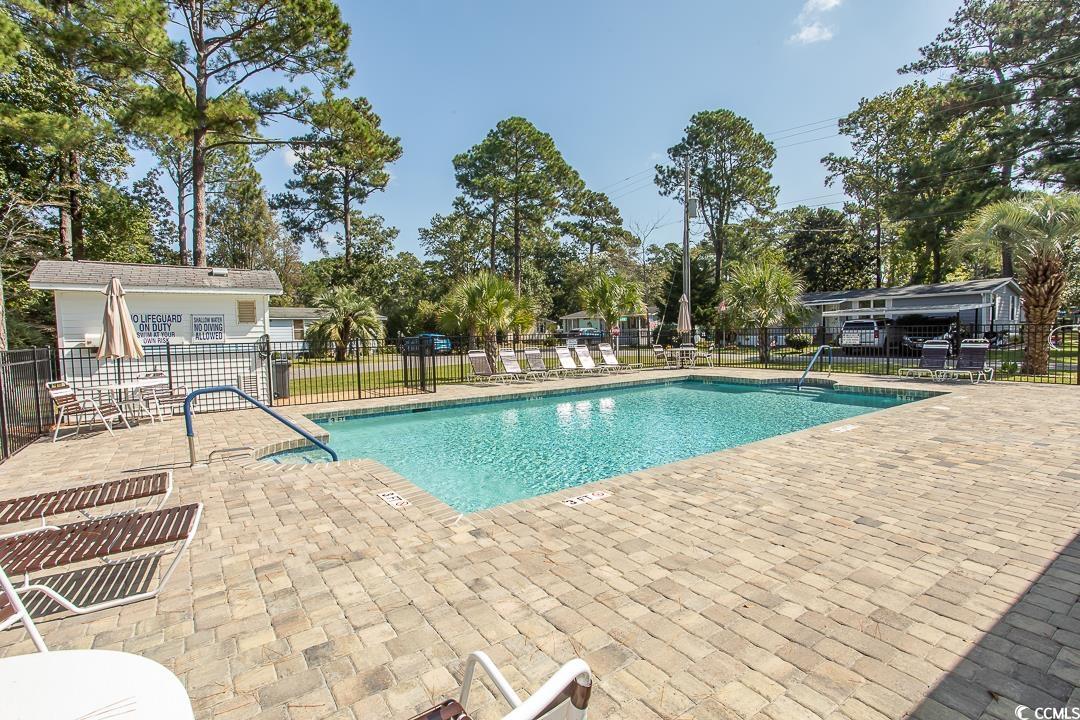 826 Jensen Drive North Murrells Inlet, SC 29576 - Photo 38 of 38 Community pool with a patio