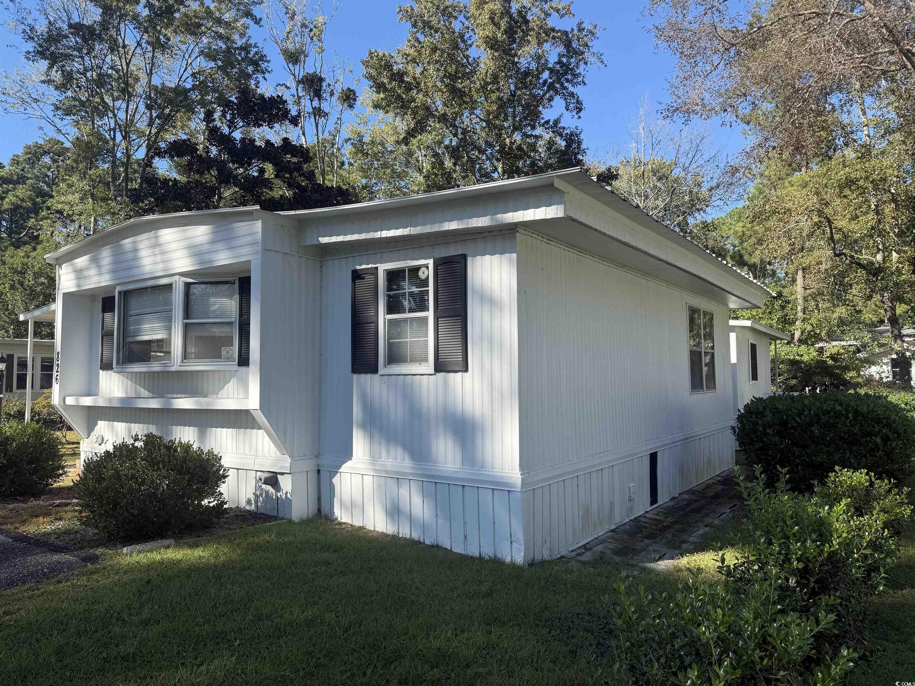 826 Jensen Drive North Murrells Inlet, SC 29576 - Photo 6 of 38 View of side of property featuring a lawn