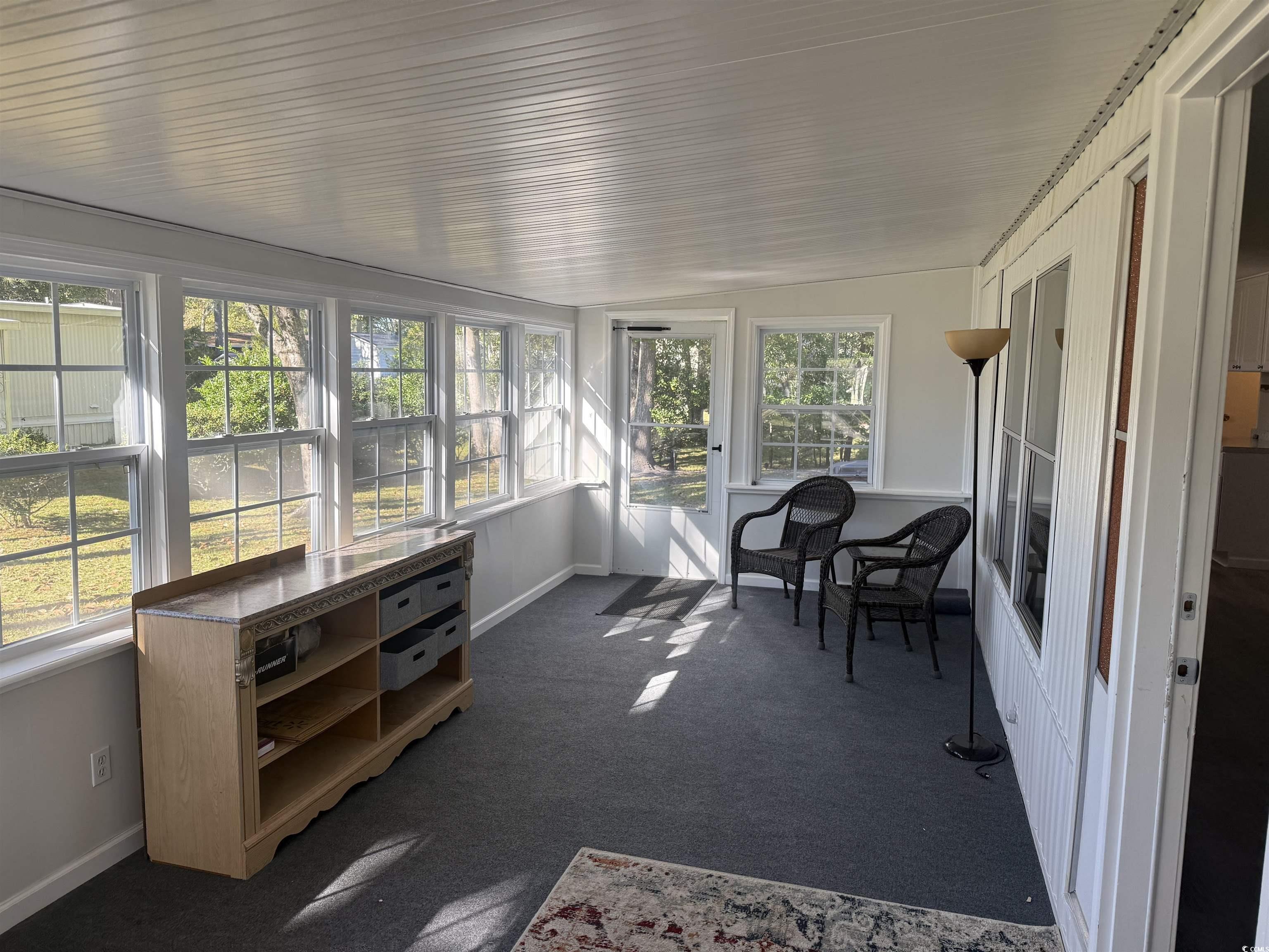 826 Jensen Drive North Murrells Inlet, SC 29576 - Photo 8 of 38 Sunroom with carpet and vaulted ceiling
