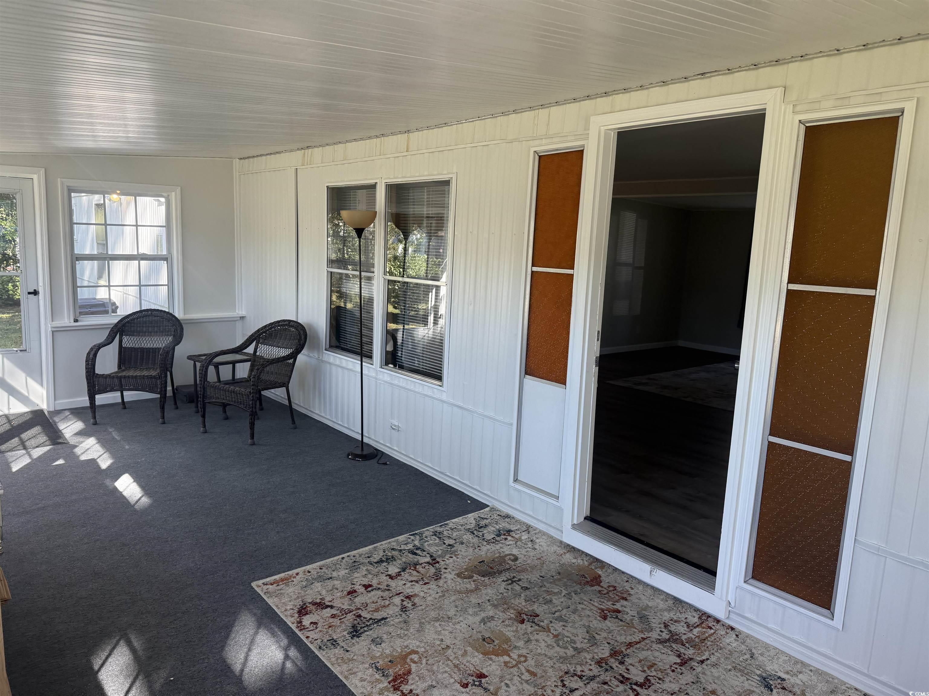 826 Jensen Drive North Murrells Inlet, SC 29576 - Photo 9 of 38 Sunroom featuring carpet
