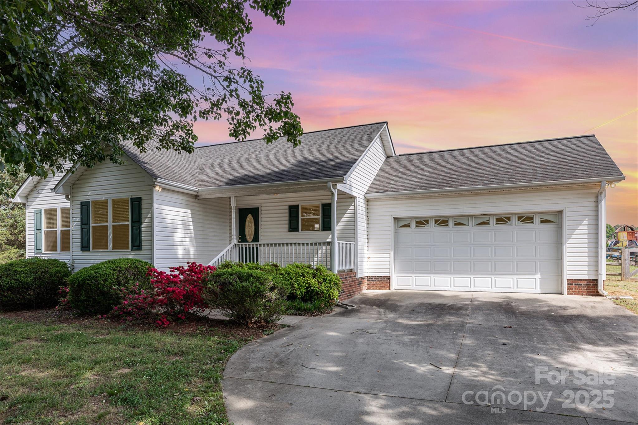 4751 Kemp Dellinger Road Maiden, NC 28650 - Photo 1 of 17 a front view of a house with a garden