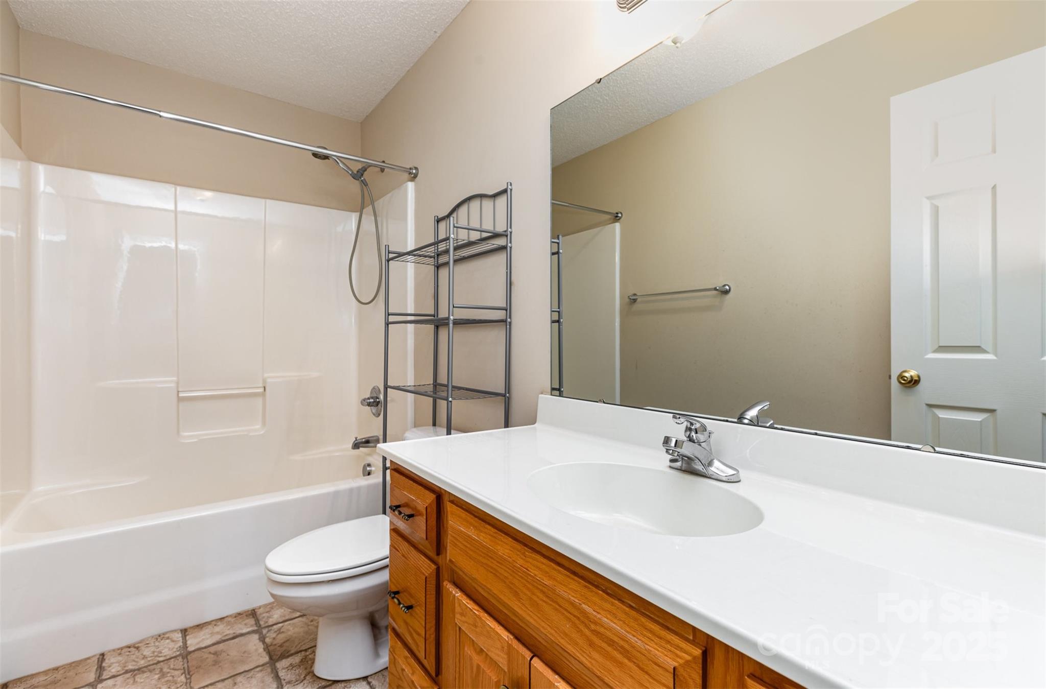 4751 Kemp Dellinger Road Maiden, NC 28650 - Photo 12 of 17 a bathroom with a sink toilet a mirror and shower