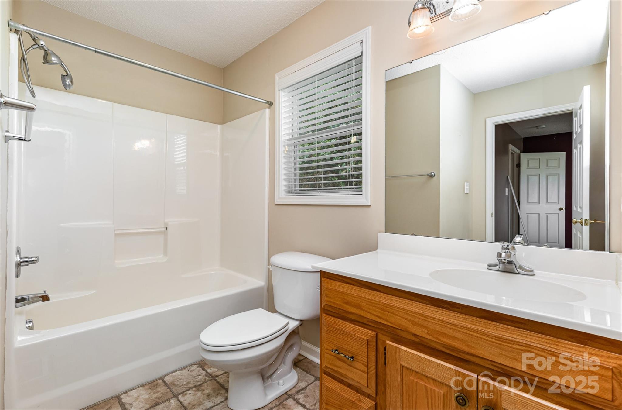 4751 Kemp Dellinger Road Maiden, NC 28650 - Photo 16 of 17 a bathroom with a sink toilet and shower
