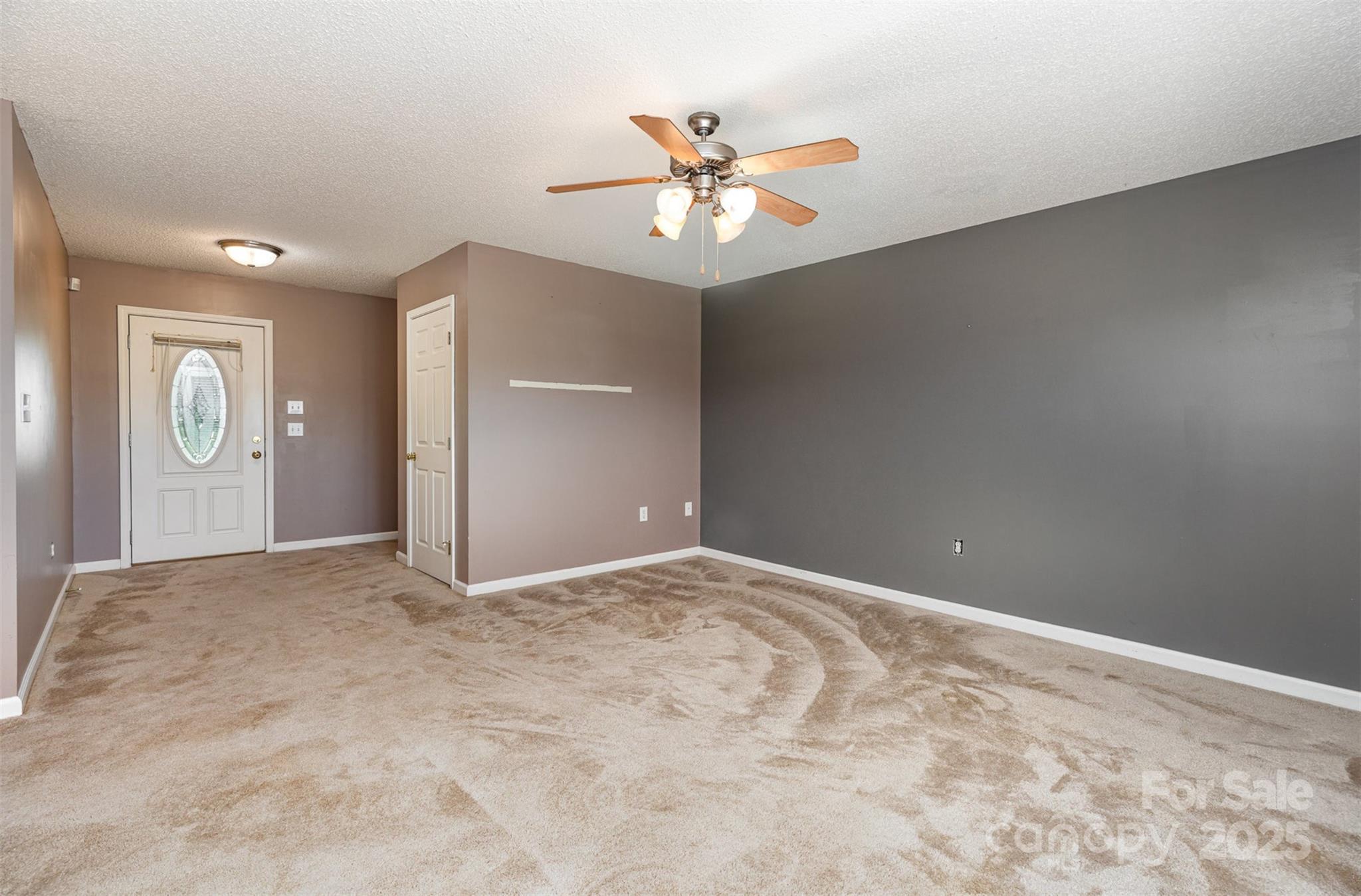4751 Kemp Dellinger Road Maiden, NC 28650 - Photo 4 of 17 an empty room with closet and fan
