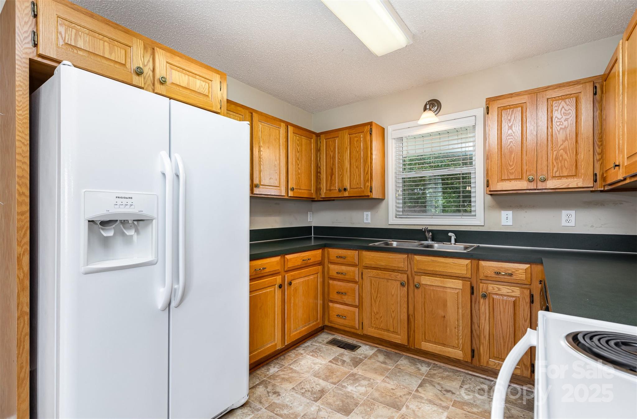 4751 Kemp Dellinger Road Maiden, NC 28650 - Photo 8 of 17 a kitchen with stainless steel appliances granite countertop a refrigerator and a sink