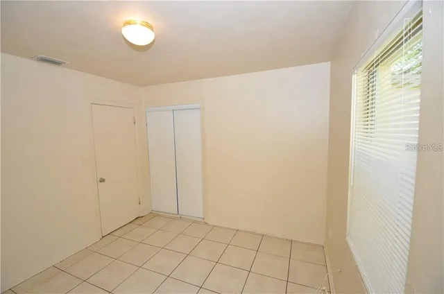 a view of an empty room and window