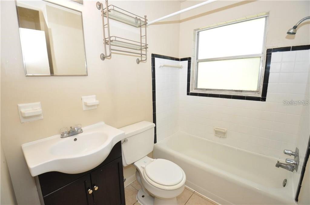 509 Norfolk Circle Lakeland, FL 33801 - Photo 14 of 14 a bathroom with a sink toilet and shower