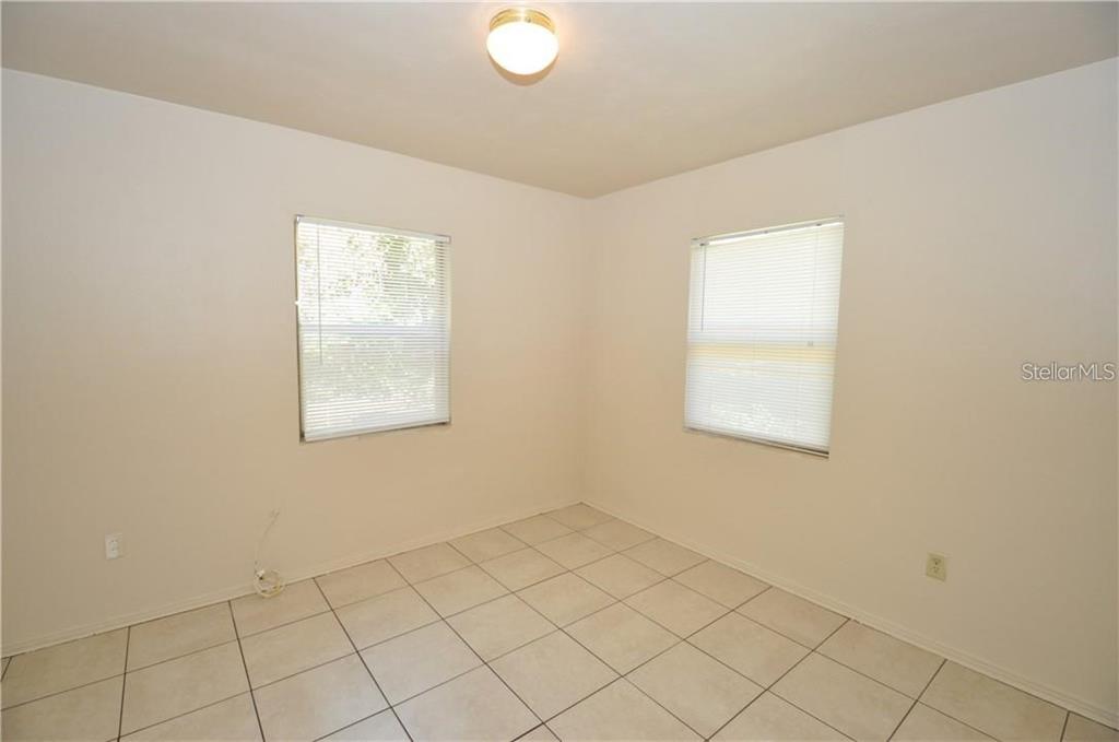 509 Norfolk Circle Lakeland, FL 33801 - Photo 10 of 14 an empty room with windows