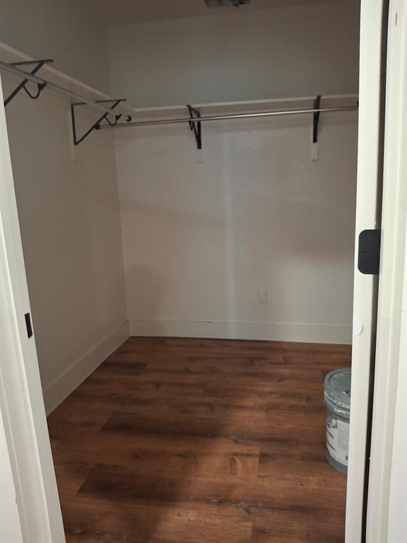 900 Chestnut Street Commerce, TX 75428 - Photo 11 of 19 a view of a room with wooden racks