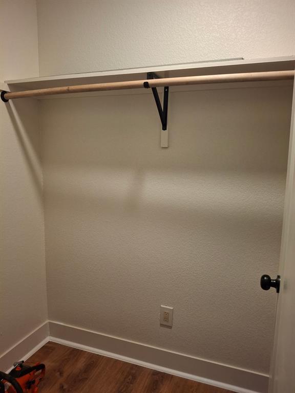 900 Chestnut Street Commerce, TX 75428 - Photo 14 of 19 a view of a room with racks on the wall