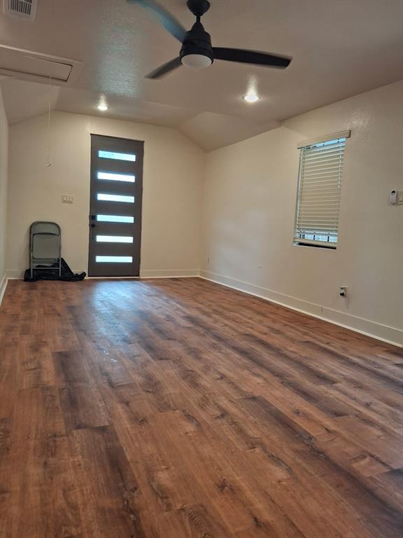 900 Chestnut Street Commerce, TX 75428 - Photo 6 of 19 an empty room with windows