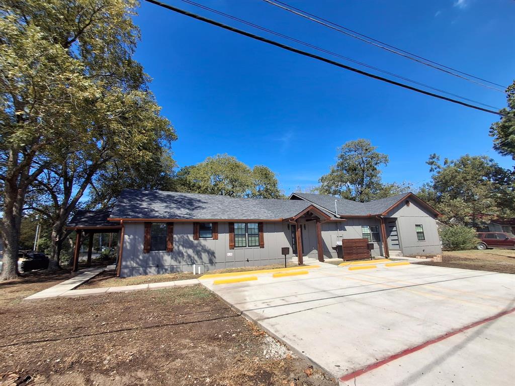 900 Chestnut Street Commerce, TX 75428 - Photo 9 of 19 a swimming pool with outdoor seating