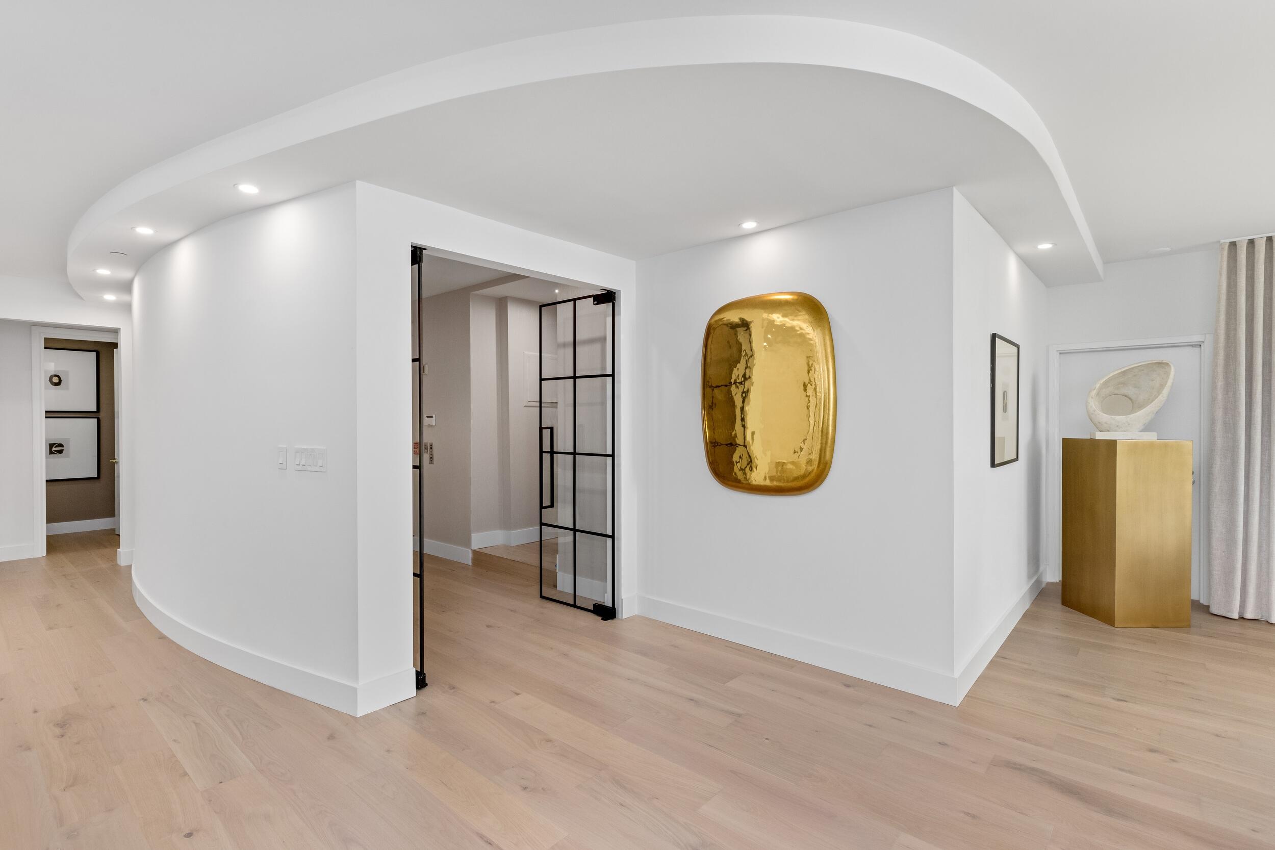 2494 South Ocean Boulevard, Unit C5 Boca Raton, FL 33432 - Photo 13 of 52 a view of a room with wooden floor and mirror