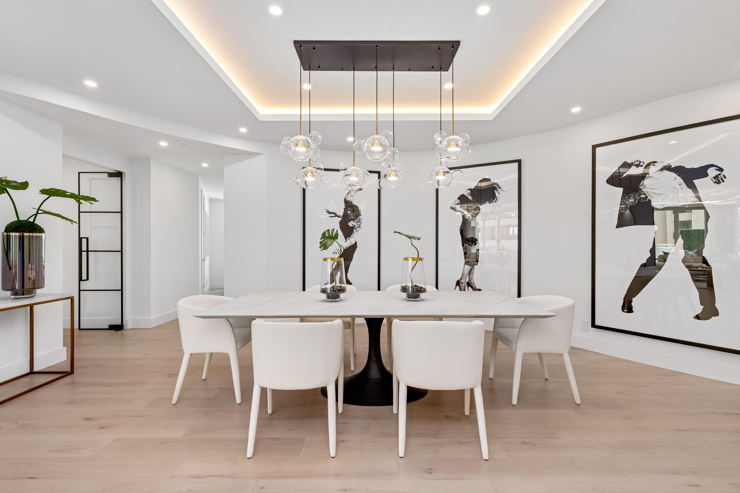 2494 South Ocean Boulevard, Unit C5 Boca Raton, FL 33432 - Photo 14 of 52 a kitchen with stainless steel appliances kitchen island granite countertop a dining table chairs and white cabinets