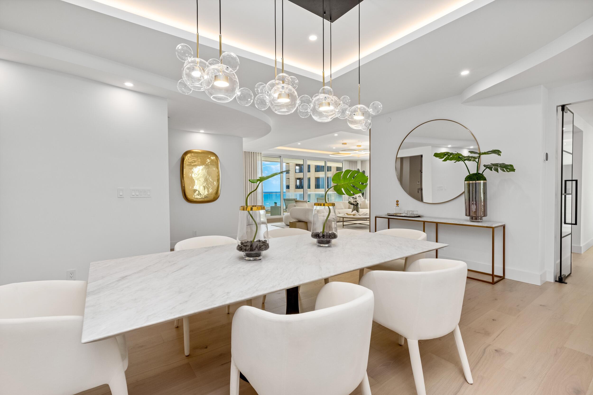2494 South Ocean Boulevard, Unit C5 Boca Raton, FL 33432 - Photo 16 of 52 a view of a dining room with furniture and a chandelier