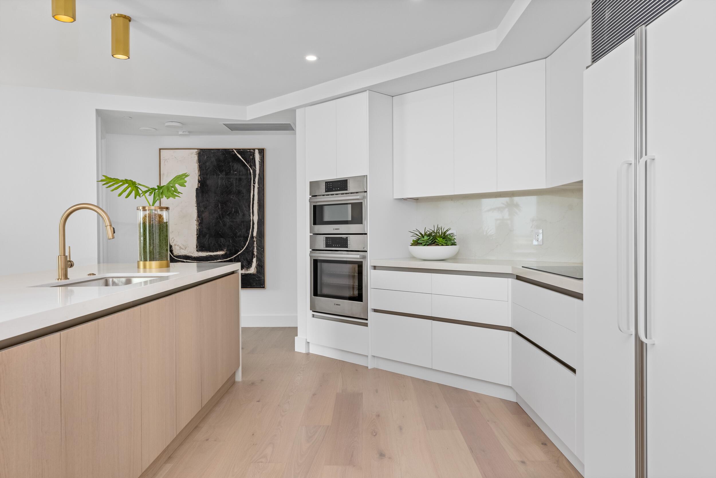 2494 South Ocean Boulevard, Unit C5 Boca Raton, FL 33432 - Photo 23 of 52 a kitchen with a refrigerator and a sink