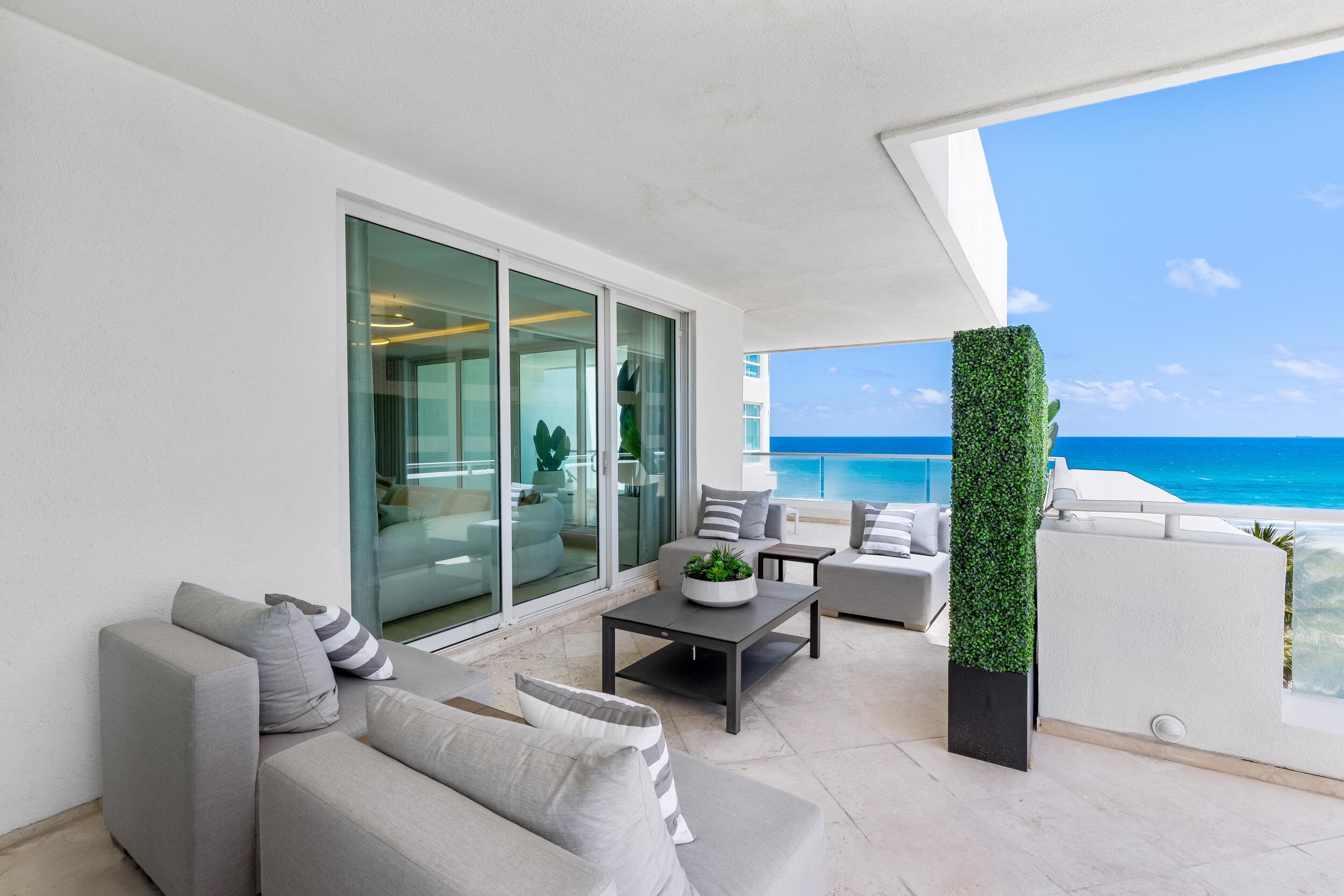 2494 South Ocean Boulevard, Unit C5 Boca Raton, FL 33432 - Photo 33 of 52 a living room with furniture and a floor to ceiling window