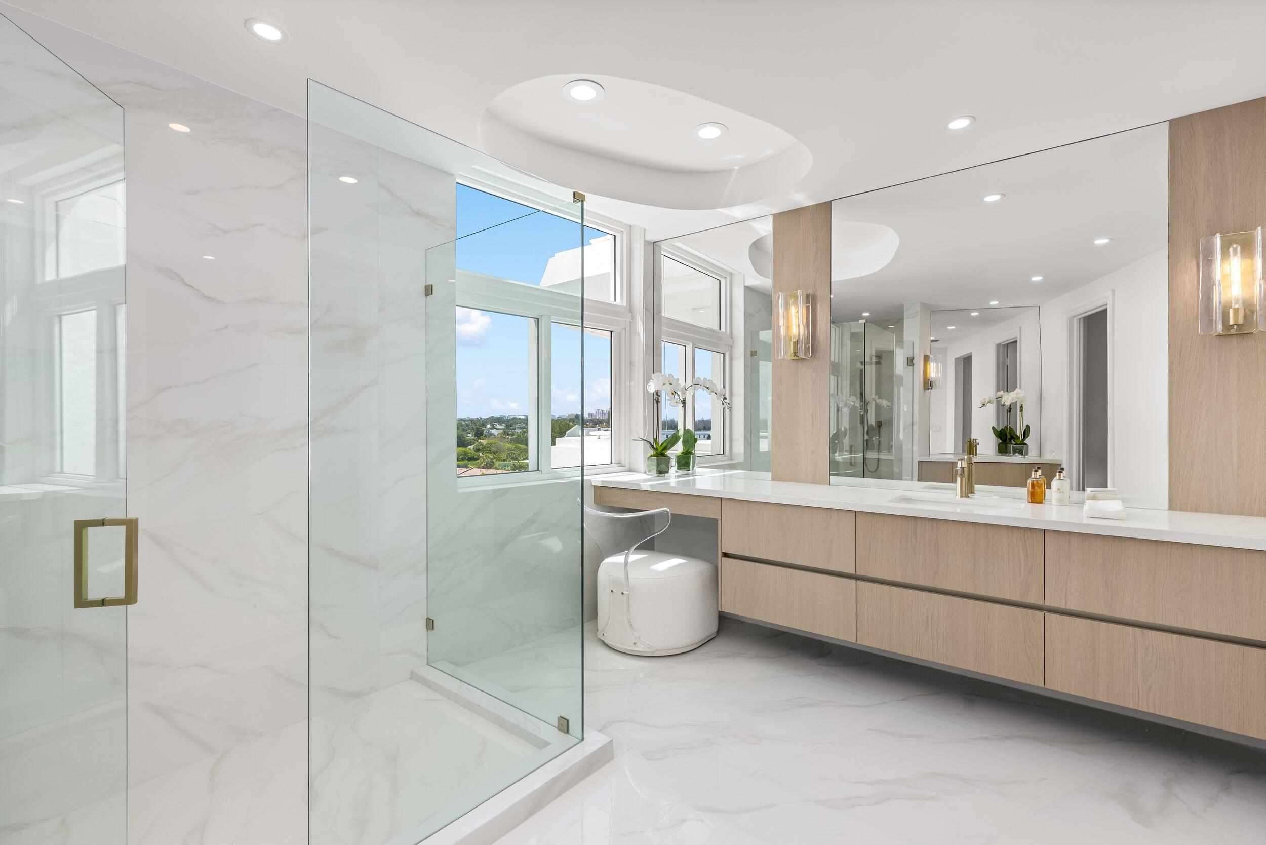 2494 South Ocean Boulevard, Unit C5 Boca Raton, FL 33432 - Photo 39 of 52 a bathroom with a double vanity sink mirror and shower