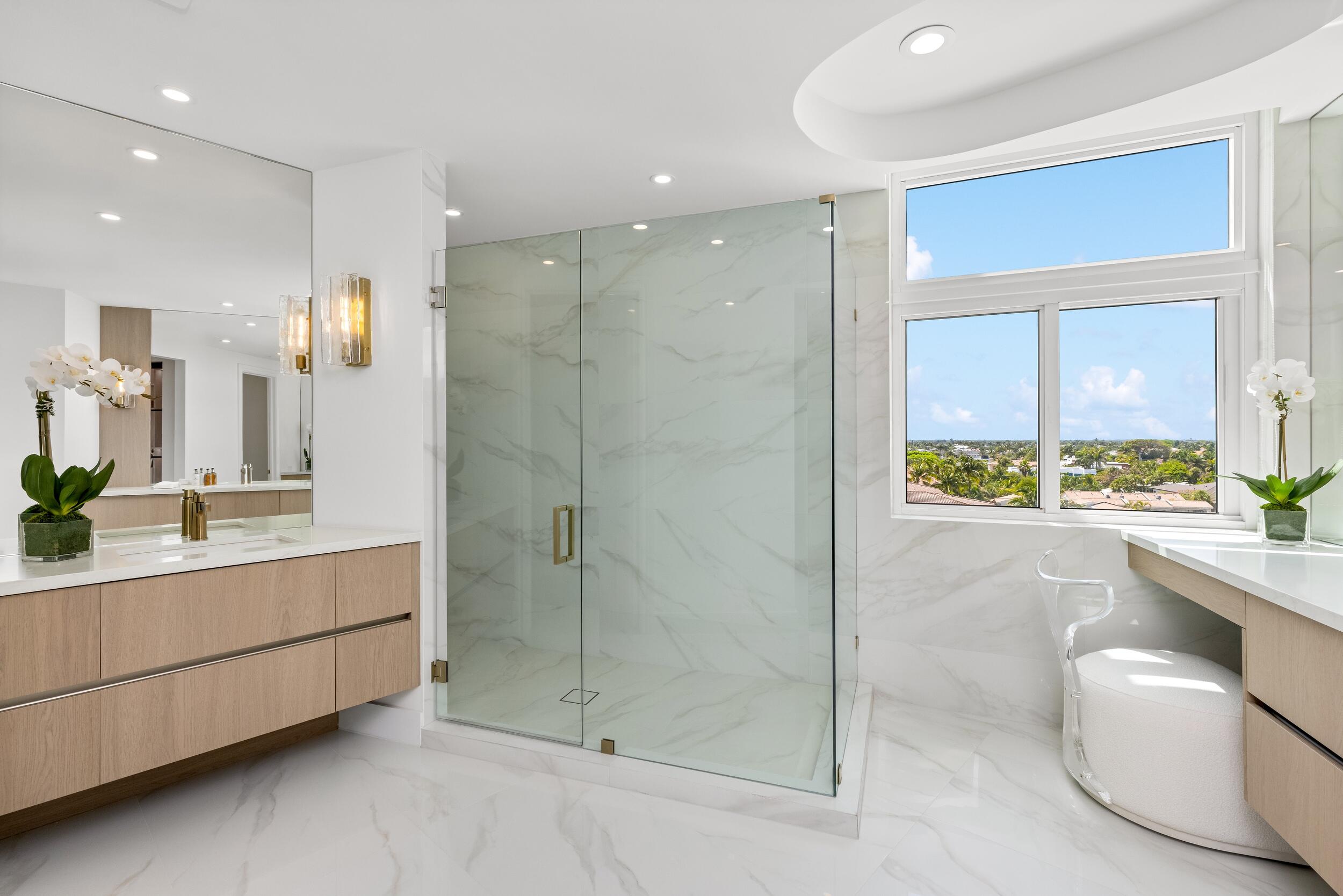 2494 South Ocean Boulevard, Unit C5 Boca Raton, FL 33432 - Photo 40 of 52 a bathroom with a double vanity sink and mirror