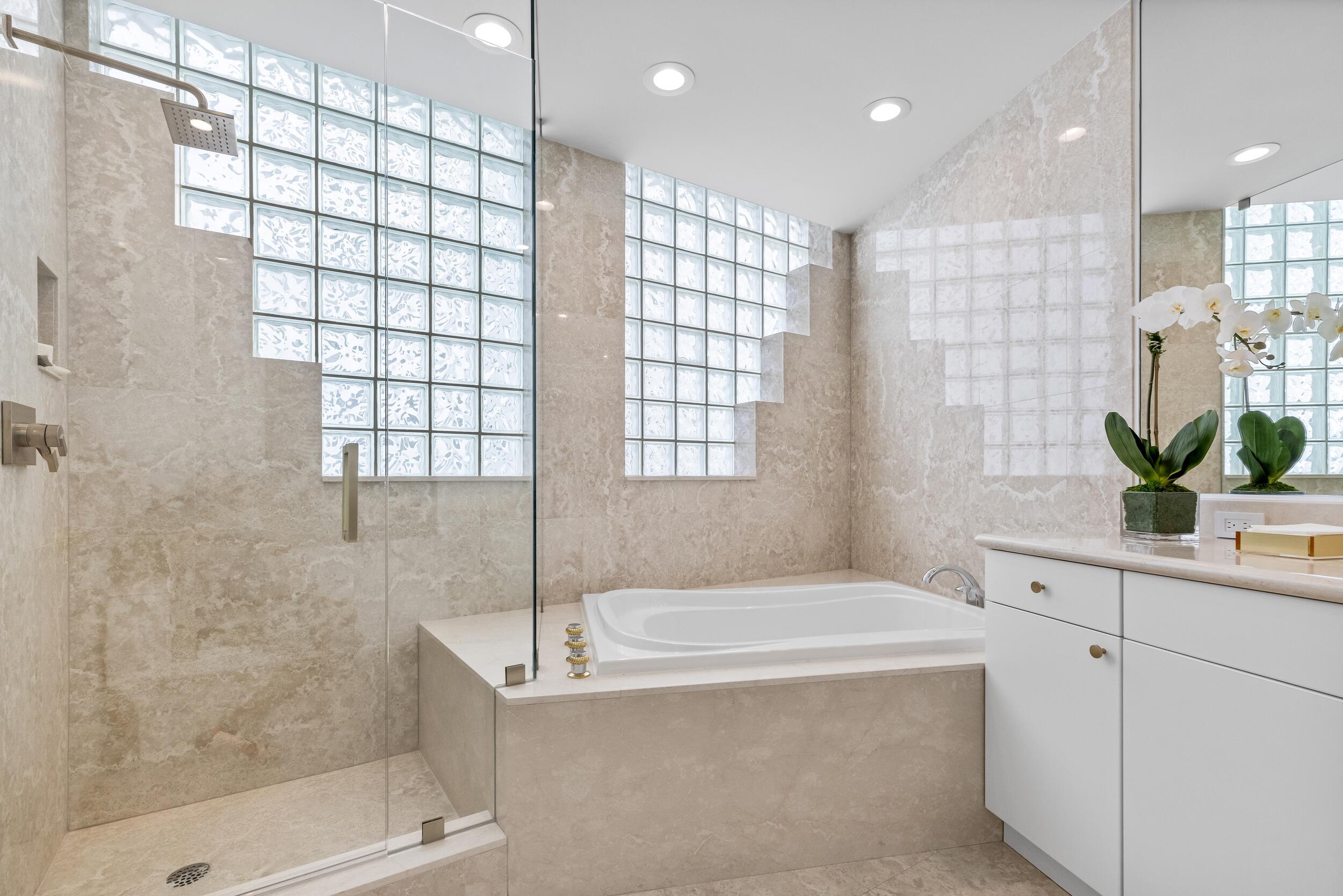 2494 South Ocean Boulevard, Unit C5 Boca Raton, FL 33432 - Photo 47 of 52 a bathroom with a granite countertop sink a mirror and a shower