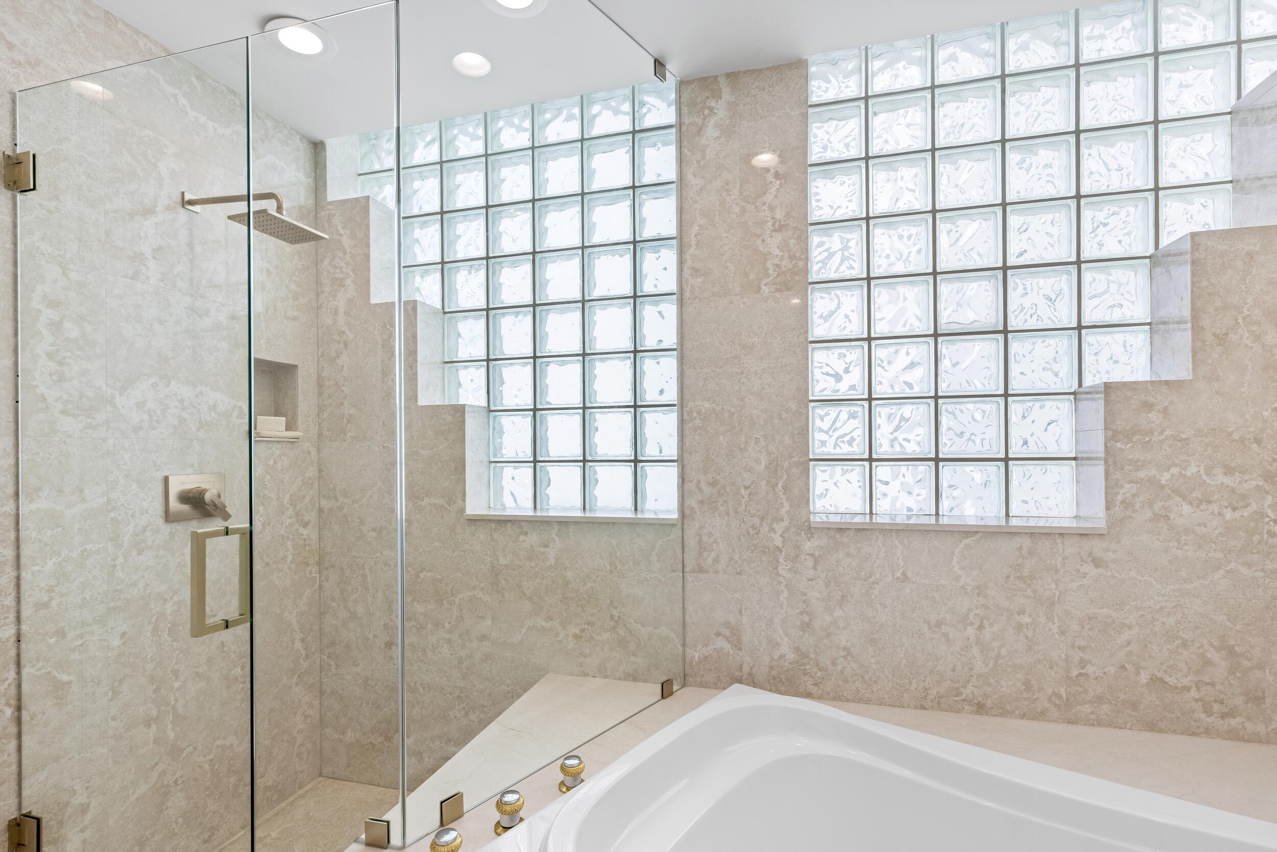 2494 South Ocean Boulevard, Unit C5 Boca Raton, FL 33432 - Photo 48 of 52 a bathroom with a bathtub and shower