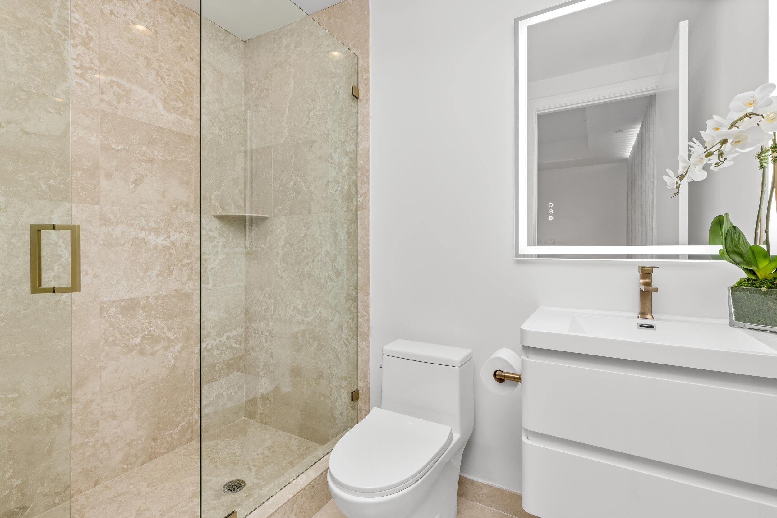 2494 South Ocean Boulevard, Unit C5 Boca Raton, FL 33432 - Photo 49 of 52 a bathroom with a sink toilet and shower