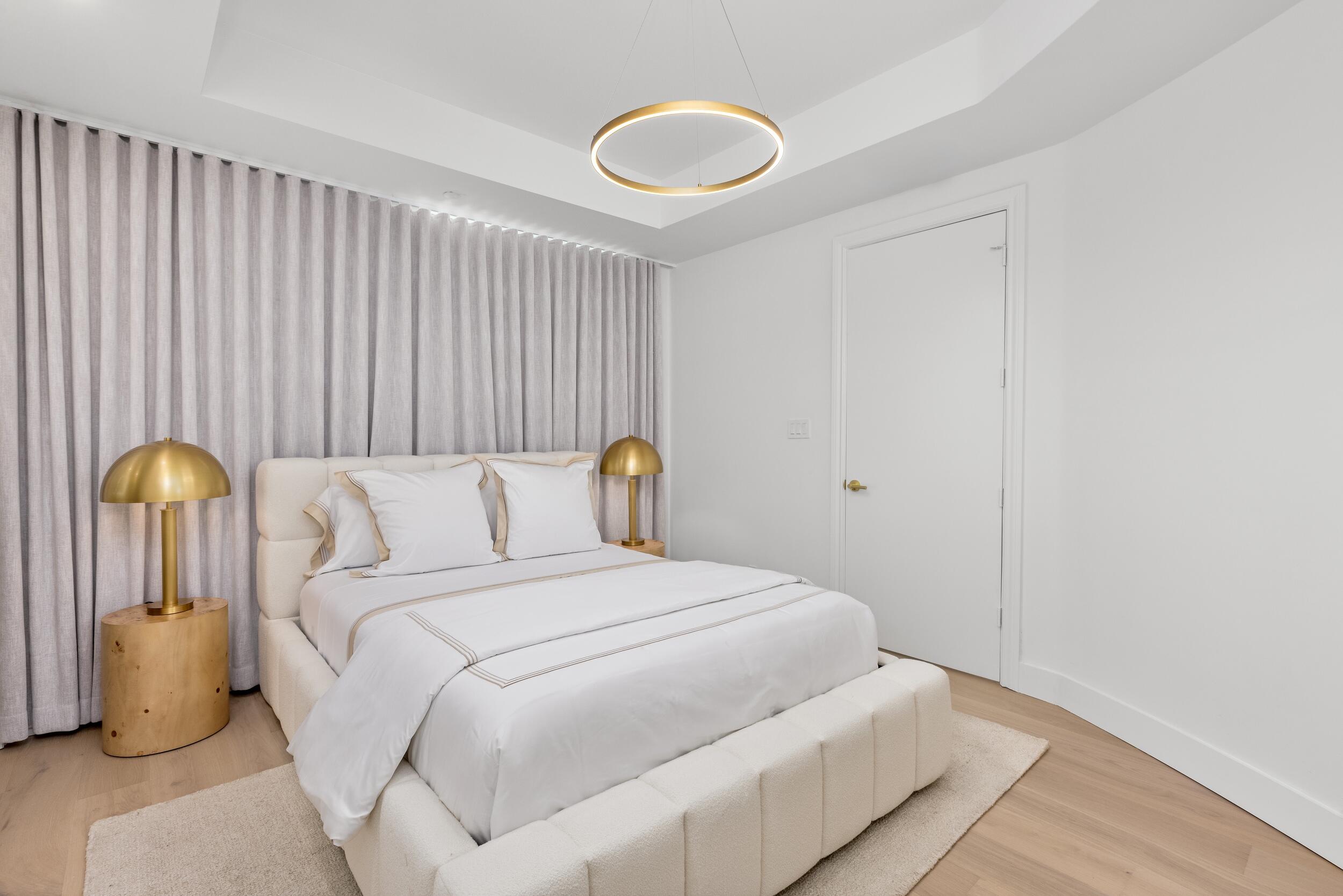 2494 South Ocean Boulevard, Unit C5 Boca Raton, FL 33432 - Photo 50 of 52 a bedroom with a bed and lamp