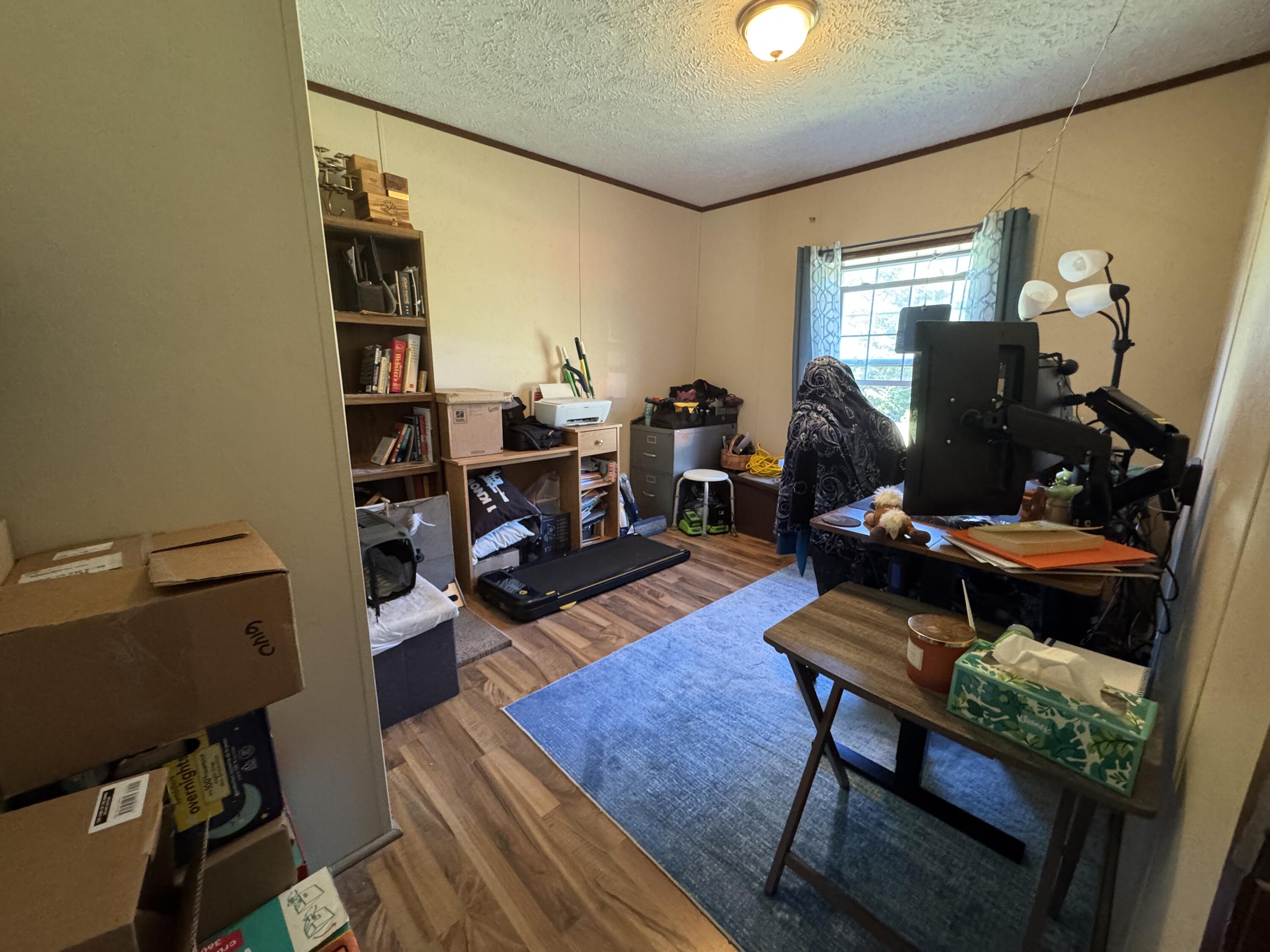 300 White Oak Road Boones Mill, VA 24065 - Photo 11 of 28 a living room with furniture a rug and a window