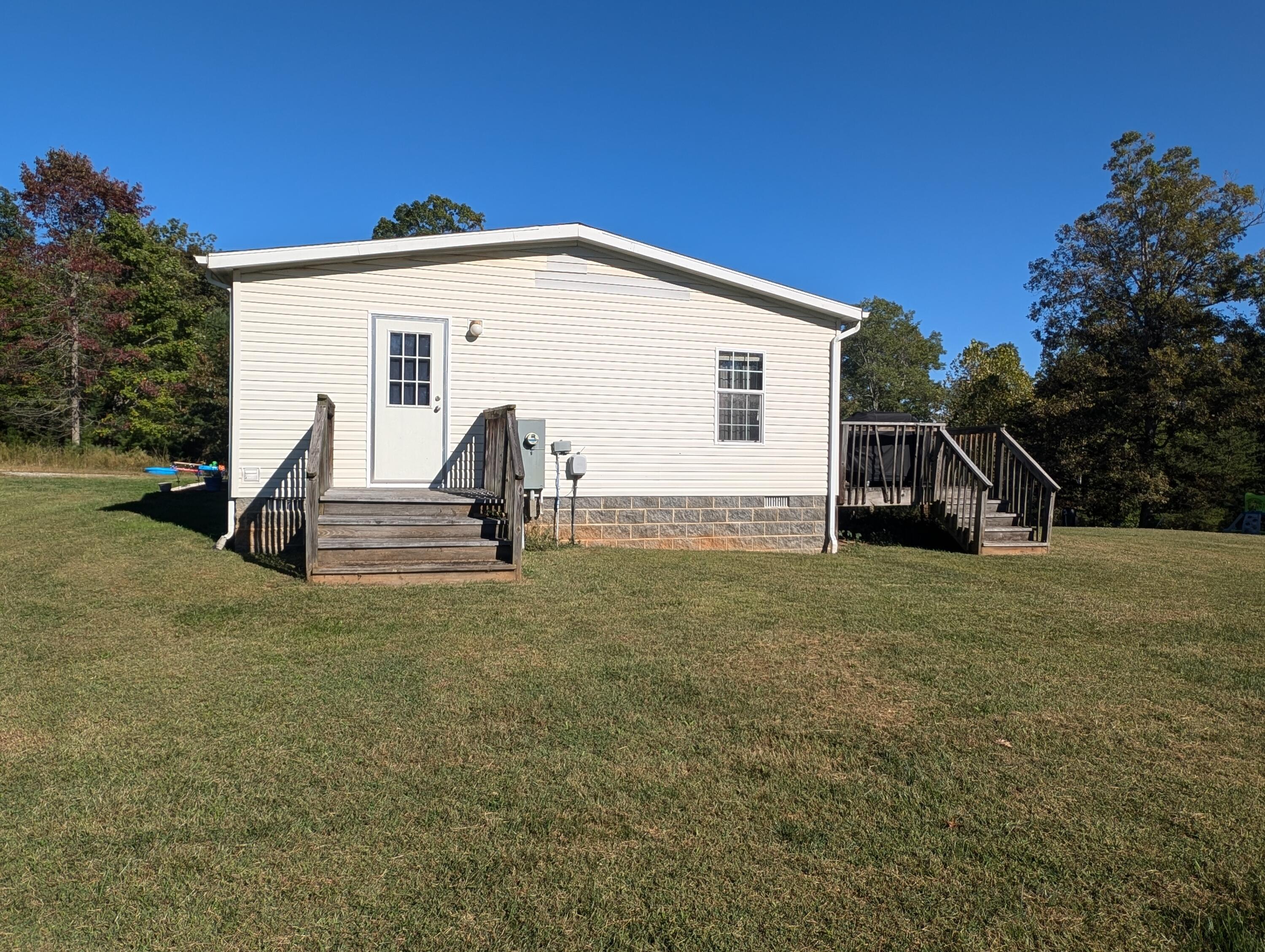 300 White Oak Road Boones Mill, VA 24065 - Photo 18 of 28 a view of a house with backyard
