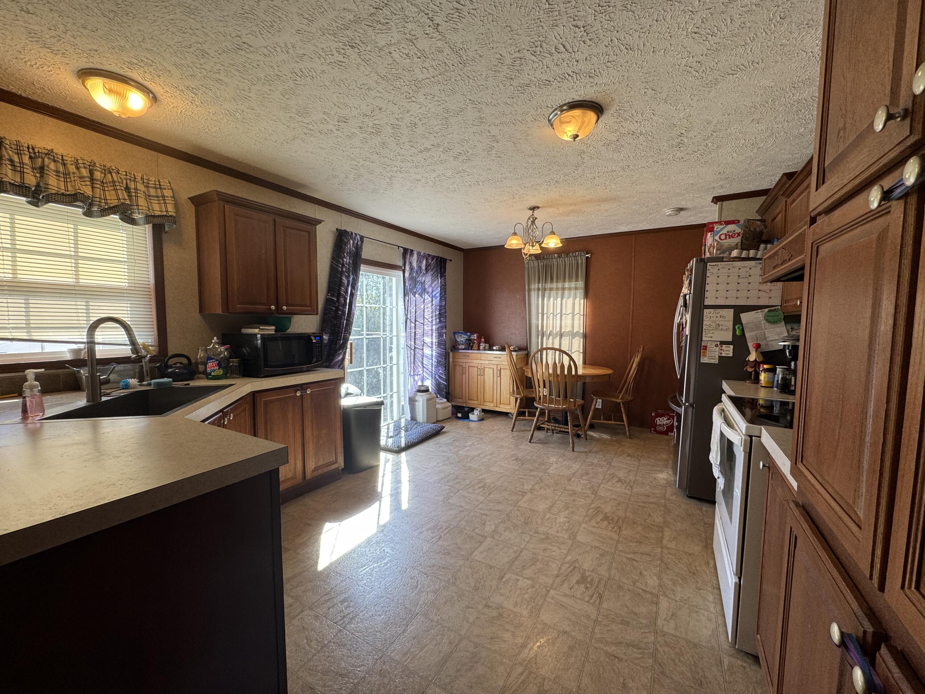 300 White Oak Road Boones Mill, VA 24065 - Photo 4 of 28 a kitchen with refrigerator and window
