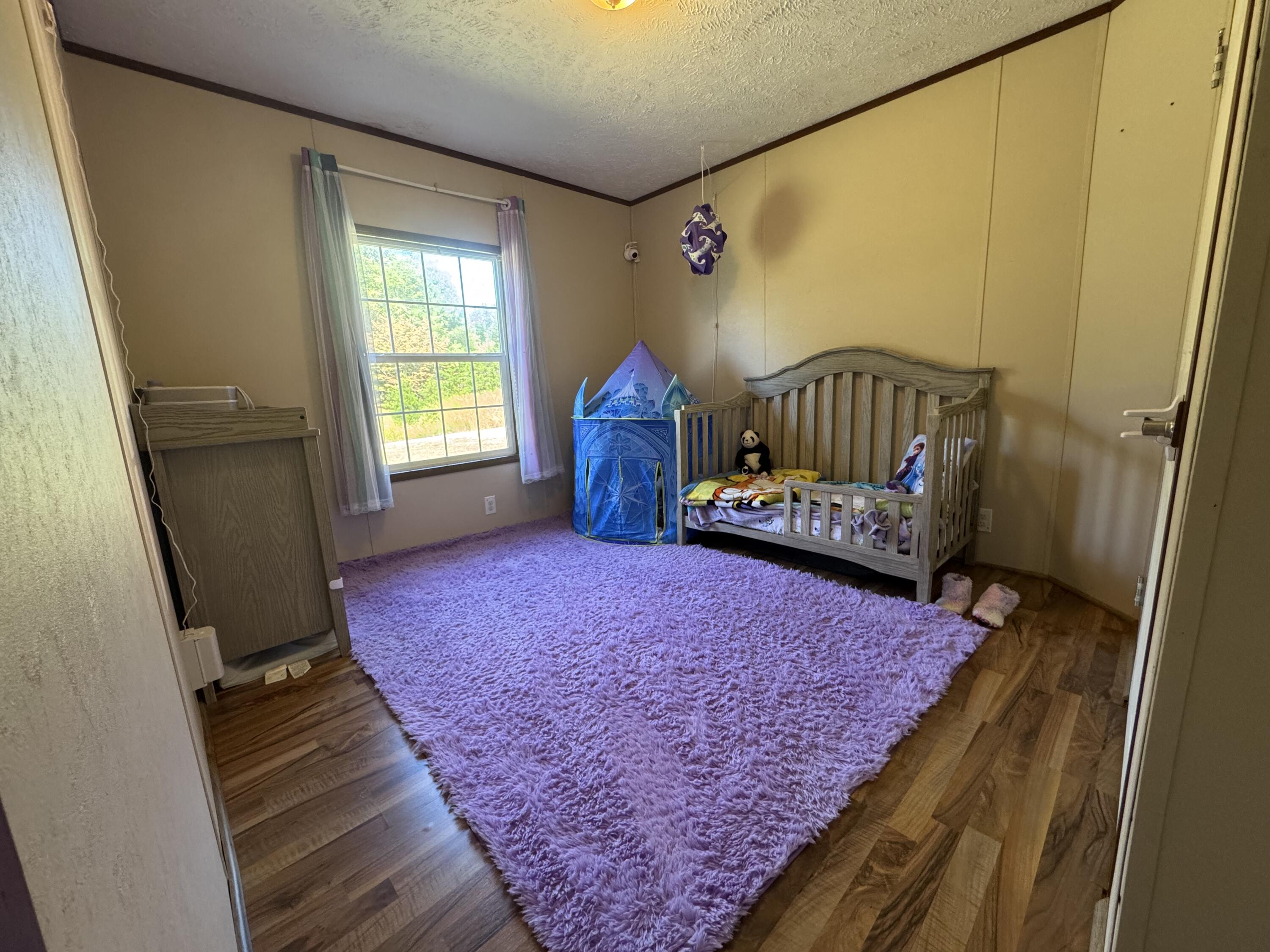 300 White Oak Road Boones Mill, VA 24065 - Photo 9 of 28 a bedroom with a bed and a window