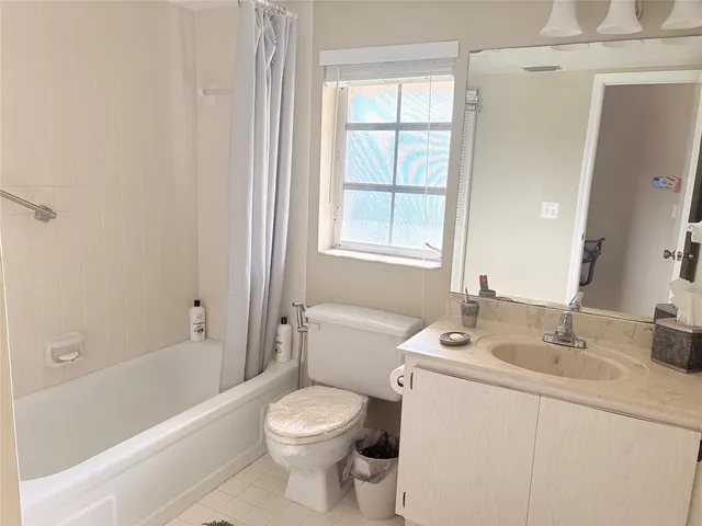 a bathroom with a sink toilet and bathtub