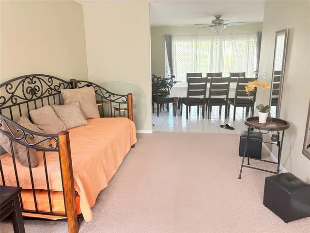 a bed room with a bed and a chair