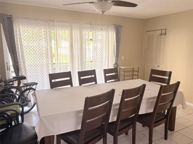 a view of a dining room with furniture and window