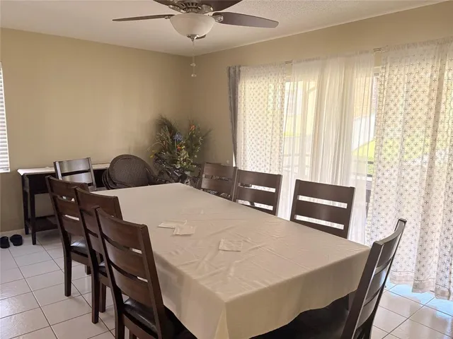 a kitchen with a table and chairs